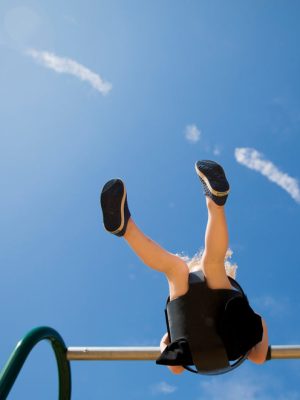 a-child-on-a-swing-under-a-blue-sky