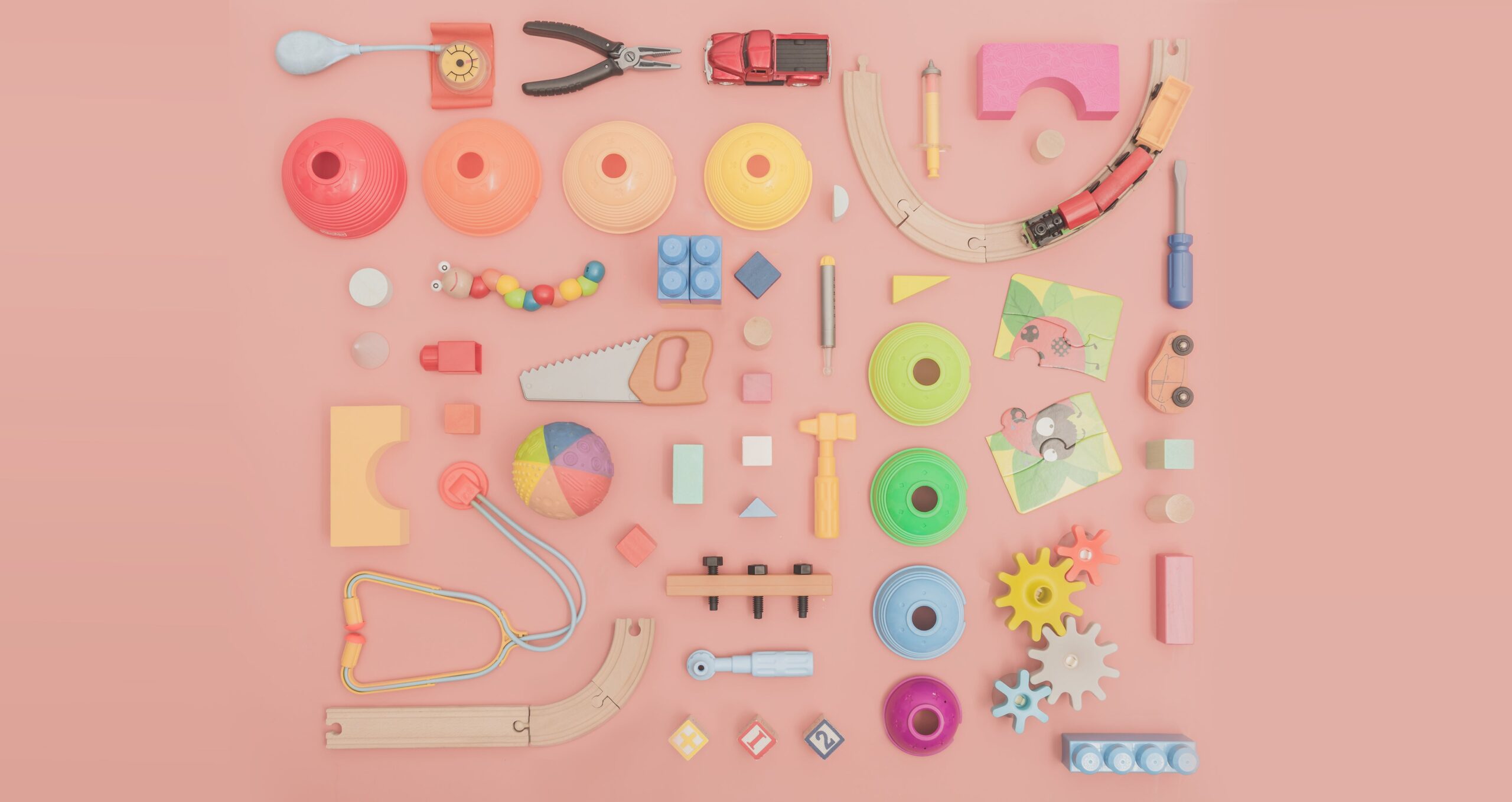 assortment-of-toys-on-pink